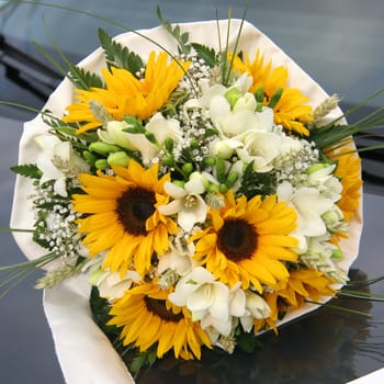 A brides wedding bouquet of sunflowers