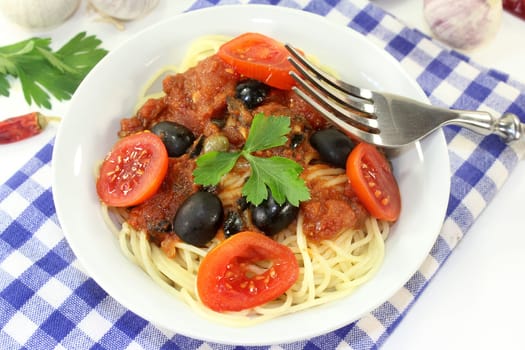 Capellini with tomatoes,anchovies,capers and olives