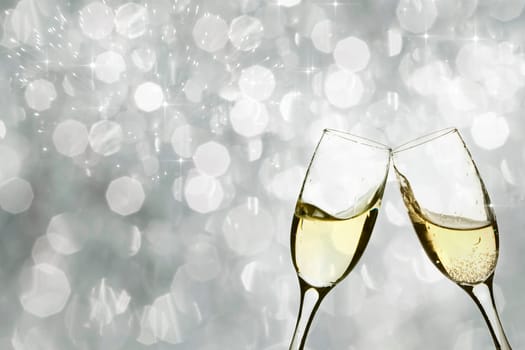 Champangne glasses on sparkling background