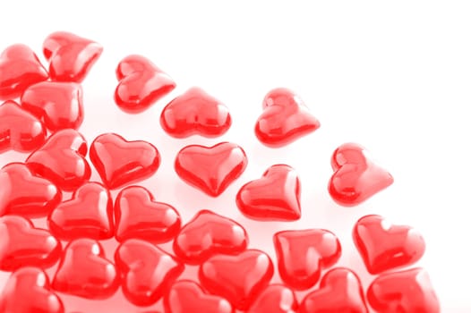 Red glass hearts on a white background