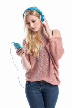 young blonde woman listens with the mobile phone music