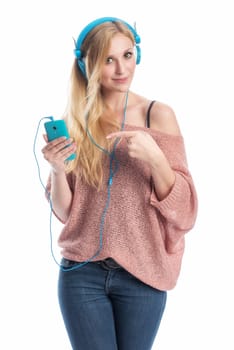 young blonde woman listens with the mobile phone music