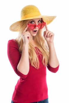 a blonde young woman wears a summer hat and sunglasses