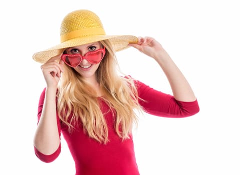 a blonde young woman wears a summer hat and sunglasses