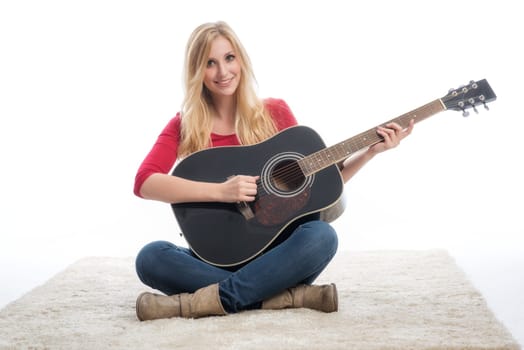 young blonde woman with guitar