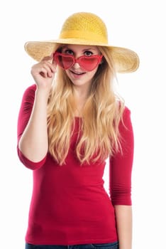 a blonde young woman wears a summer hat and sunglasses