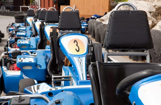 Machine karts before the start on the circuit. Parked on line
