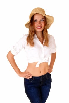 A beautiful blond woman in a white blouse and blue jeans, wearing a .straw hat, standing isolated for white background..