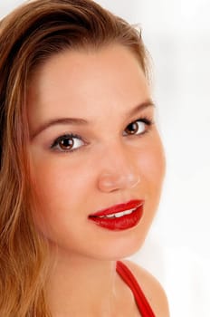 A closeup picture of a beautiful young woman with her red lips, looking.into the camera, isolated for white background..