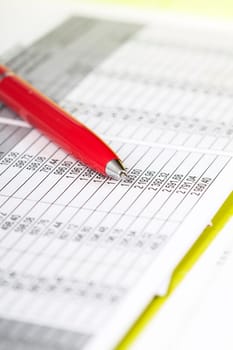 Pen over business chart. Accounting concept