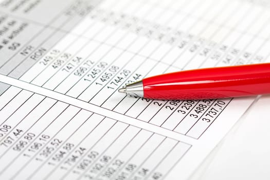 Pen over business chart. Accounting concept