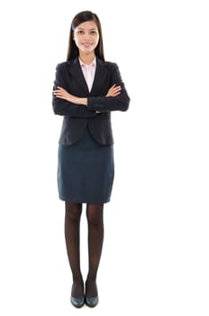 Portrait of beautiful pan Asian business woman smiling, full length standing isolated on white background.