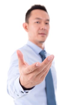 Asian business man open palm holding something, focus on palm, front view isolated over white background.