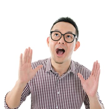 Portrait of Asian male get shocked and looking up isolated on white background.