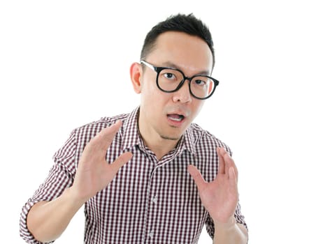 Portrait of Asian male get shocked and looking at camera isolated on white background.