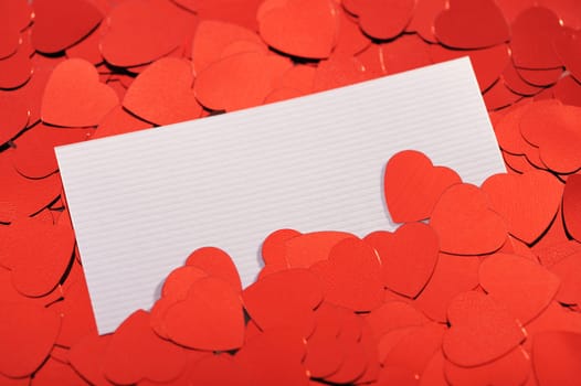 Red glitter hearts with white congratulations card