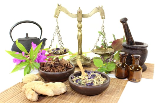 a cup of herbal tea and Chinese herbs