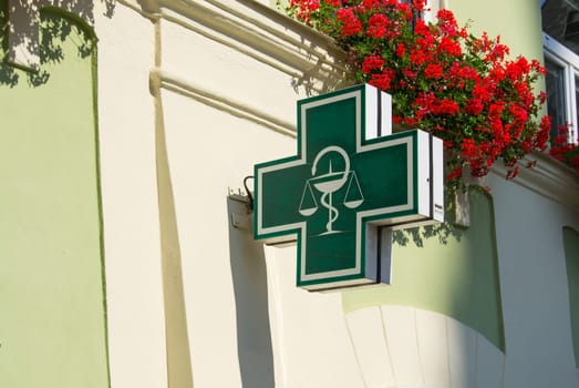 Pharmacy sign on side of the house