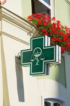 Pharmacy sign on side of the house