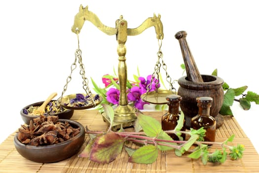 a cup of herbal tea and Chinese herbs