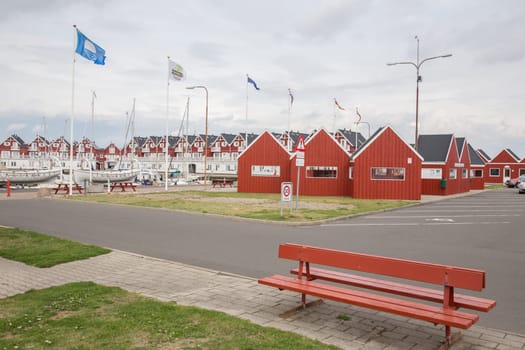Bank and huts in the foreground,apartments in the background
