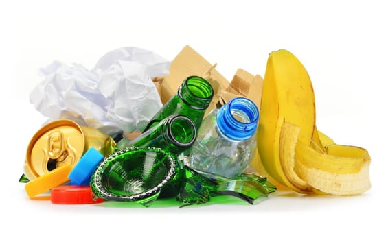 Composition with recyclable garbage consisting of glass, plastic, metal and paper isolated on white background
