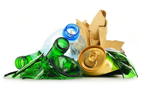 Composition with recyclable garbage consisting of glass, plastic, metal and paper isolated on white background