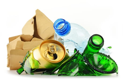 Composition with recyclable garbage consisting of glass, plastic, metal and paper isolated on white background