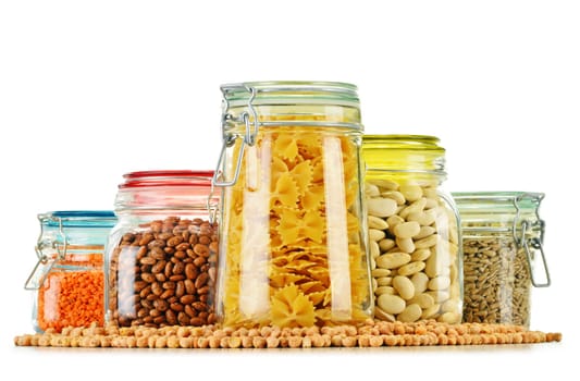Jars with grain foods isolated on white background