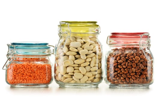 Jars with grain foods isolated on white background