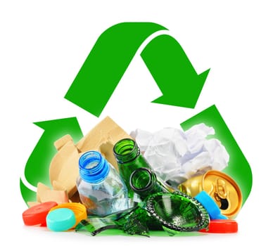Composition with recyclable garbage consisting of glass, plastic, metal and paper isolated on white background