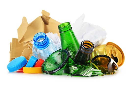 Composition with recyclable garbage consisting of glass, plastic, metal and paper isolated on white background