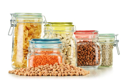 Jars with grain foods isolated on white background