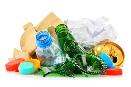 Composition with recyclable garbage consisting of glass, plastic, metal and paper isolated on white background