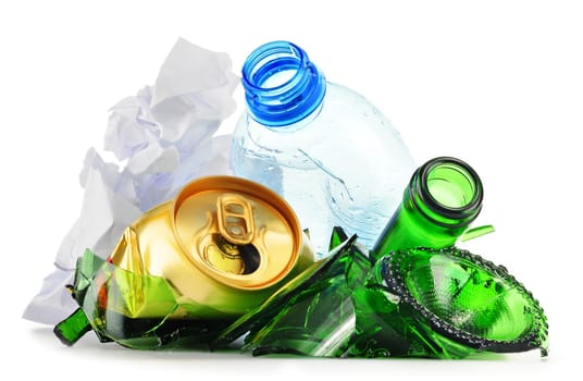 Composition with recyclable garbage consisting of glass, plastic, metal and paper isolated on white background
