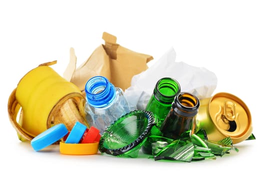 Composition with recyclable garbage consisting of glass, plastic, metal and paper isolated on white background