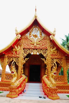 horse carriage and  temple Phrathat Lampang Luang in Lampang, Thailand