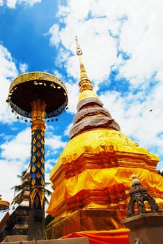 horse carriage and  temple Phrathat Lampang Luang in Lampang, Thailand