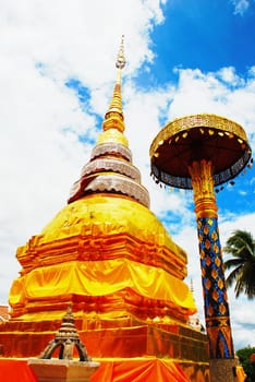 horse carriage and  temple Phrathat Lampang Luang in Lampang, Thailand