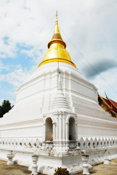 horse carriage and  temple Phrathat Lampang Luang in Lampang, Thailand