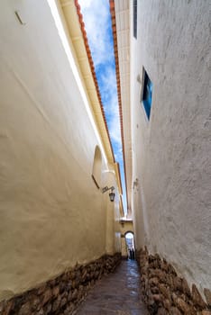 Narrow alley in the colonial historic center of Cusco, Peru