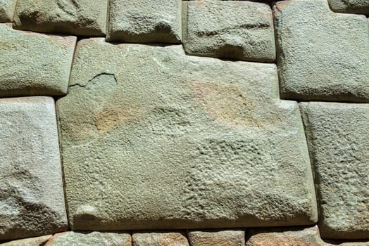 The famous 12 sided stone in old Incan stonework in Cusco, Peru