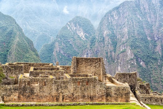 Machu Picchu ruins with mountains visible in the background