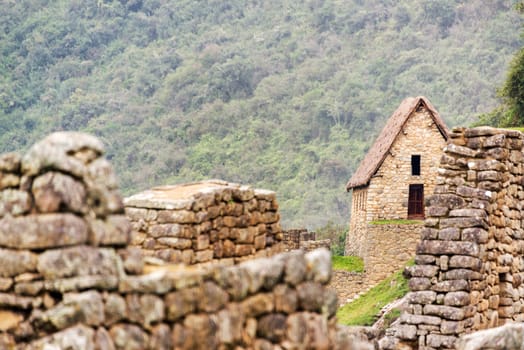 View of a building with an intact roof at the ruins of Machu Picchu, Peru