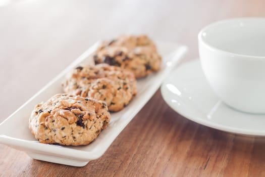 Mixed nut cookies with coffee cup, stock photo