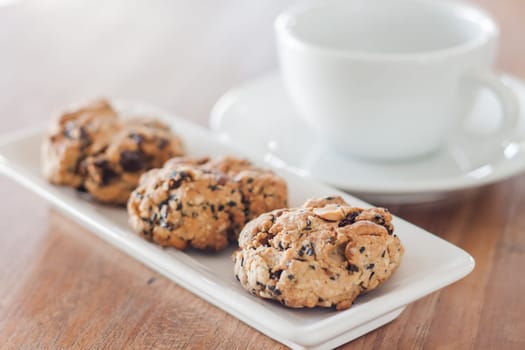 Closeup cereal cookies with coffee cup, stock photo