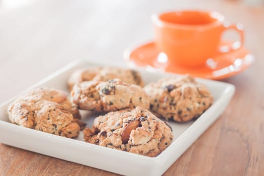 Closeup mixed nut cookies with espresso shot, stock photo