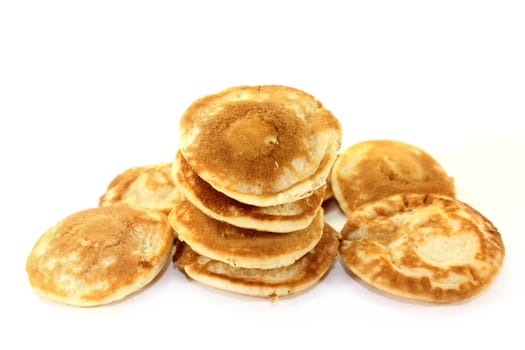baked Poffertjes against a white background