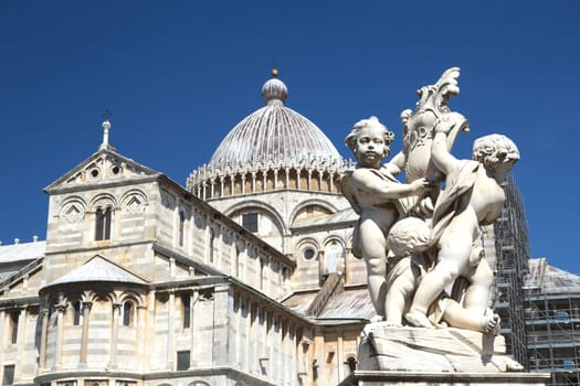 Famous sculpture at the Square of Miracles with Cathedral of St. Mary of the Assumption in the background
