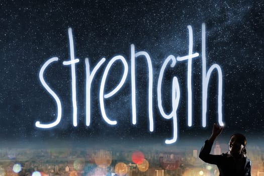 Concept of strength, silhouette asian business woman light drawing.